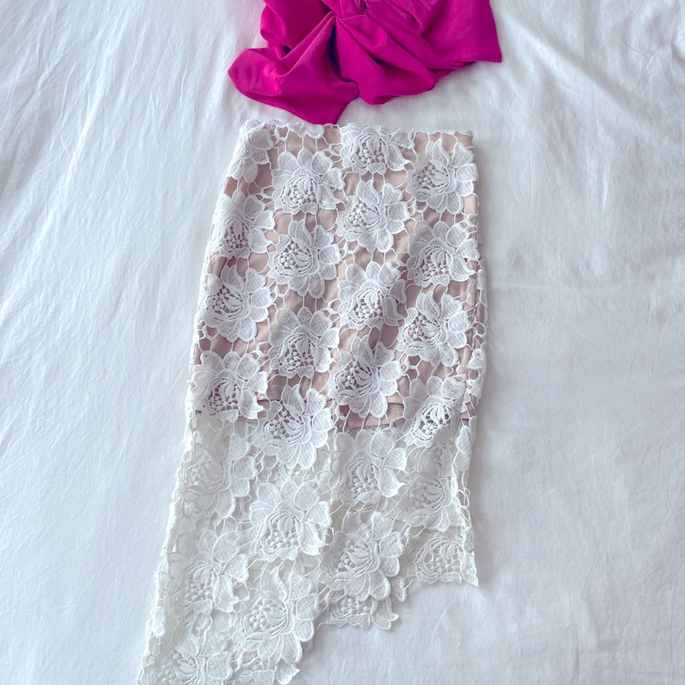 Rumor Boutique A-symmetrical nude mini skirt with eyelet overlay. Size Small